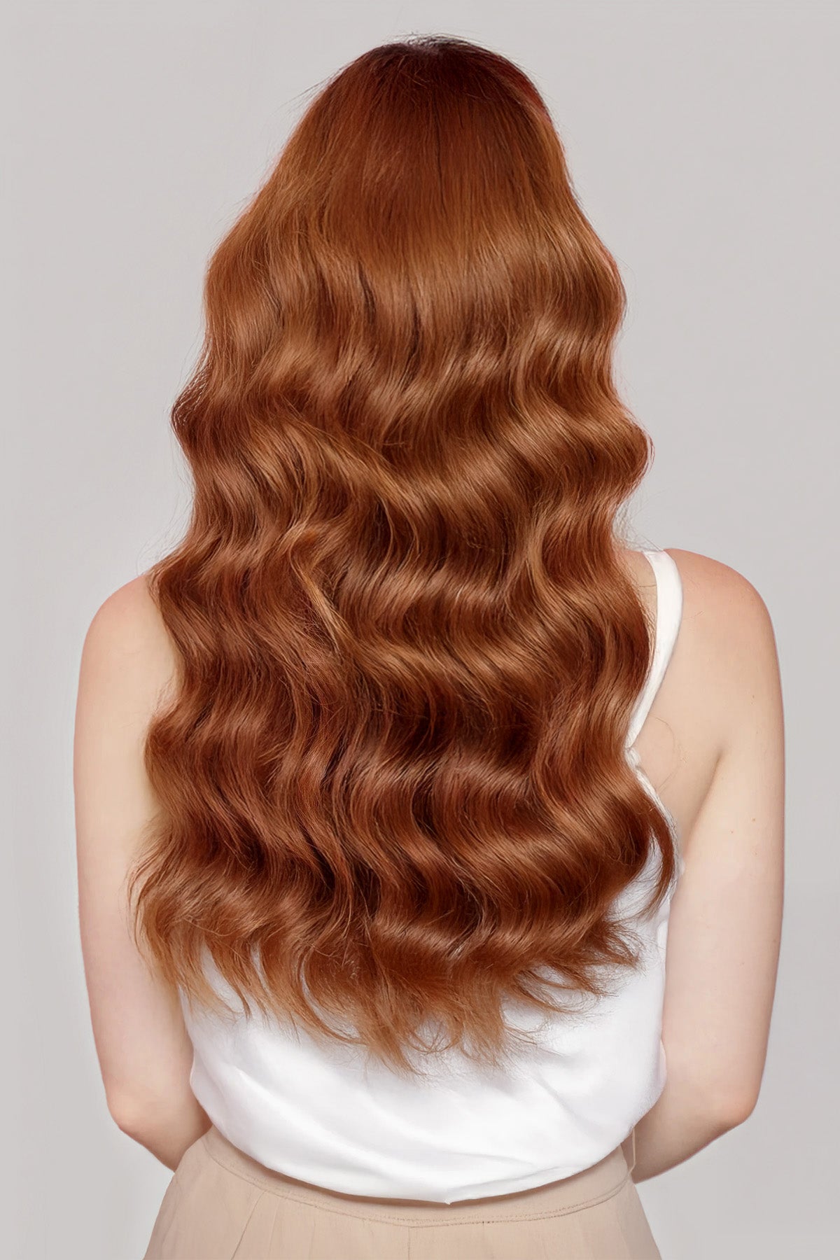 Back view of long wavy hair showcasing Dark Auburn 