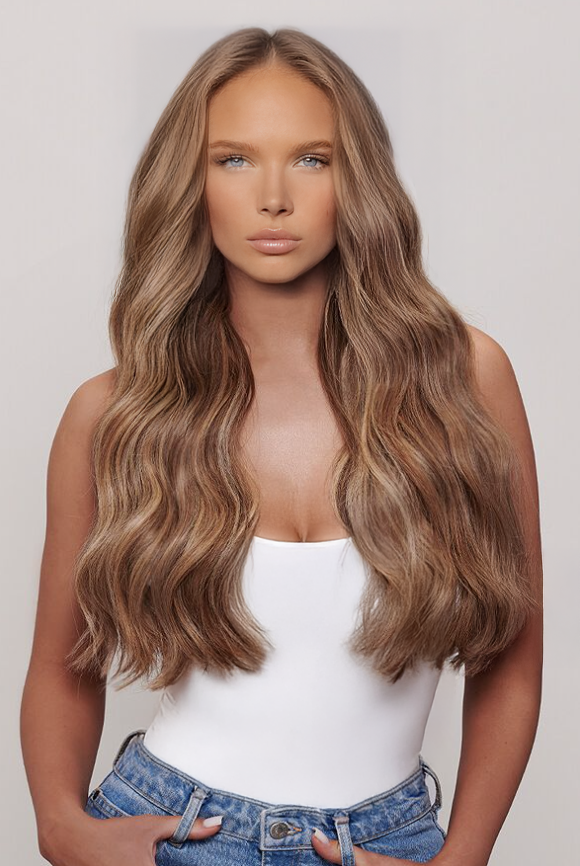 Model with long wavy hair in warm bronde highlights wearing Warm Bronde Highlights 