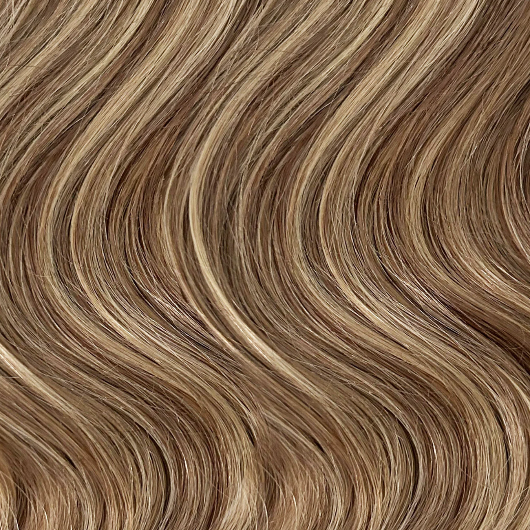 Extra Piece - Warm Bronde - #P6/18A/4 smooth wavy hair with natural warm bronde color blend and subtle highlights.